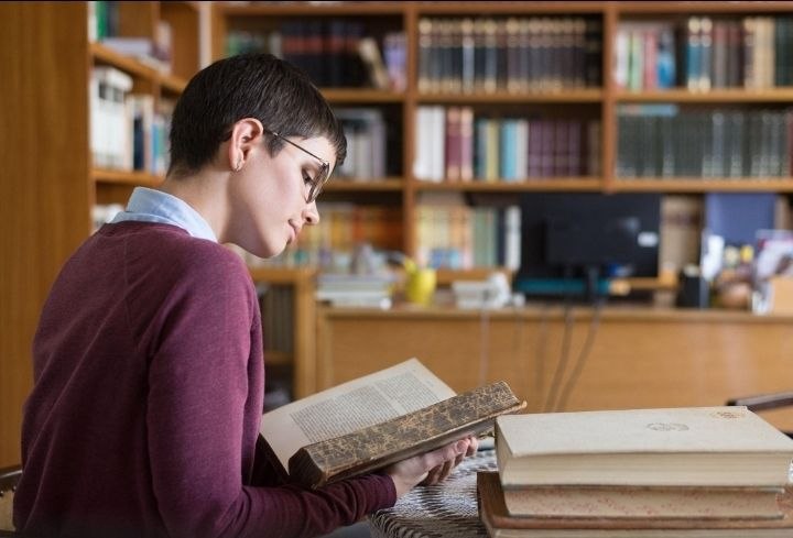 A student reading a novel
